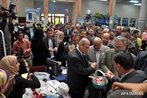 Palestinians participate in the opening of the exhibition of supporting innovative ideas in the ICT sector at Islamic university, in Gaza city, on Nov. 25, 2013. Photo by Mohammed Talatene