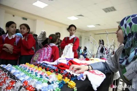 Palestinian school girls take part in the heritage gallery organized to support of the orphanage, in Jerusalem on November 25, 2013. Photo by Saeed Qaq