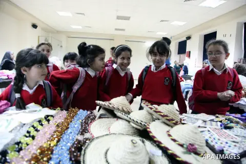 Palestinian school girls take part in the heritage gallery organized to support of the orphanage, in Jerusalem on November 25, 2013. Photo by Saeed Qaq