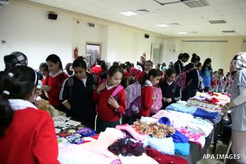 Palestinian school girls take part in the heritage gallery organized to support of the orphanage, in Jerusalem on November 25, 2013. Photo by Saeed Qaq