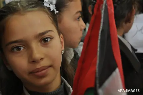 Palestinian students take part a protest against the Israeli blockade on the Gaza Strip, at al-Rantisi hospital, in Gaza city, on Nov. 26, 2013. Gaza has been almost entirely without fuel for weeks, and the resulting shu...