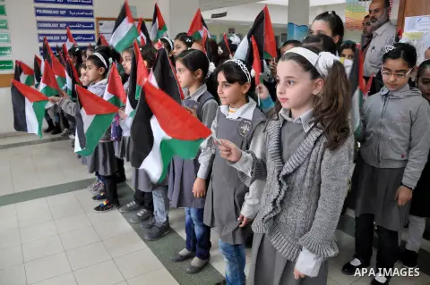 Palestinian students take part a protest against the Israeli blockade on the Gaza Strip, at al-Rantisi hospital, in Gaza city, on Nov. 26, 2013. Gaza has been almost entirely without fuel for weeks, and the resulting shu...