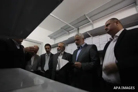 Palestinian Prime Minister in Gaza strip Ismail Haniyeh, visits the Fatwa and Legislation's office, in Gaza City on November 26, 2013. Photo by Ashraf Amra