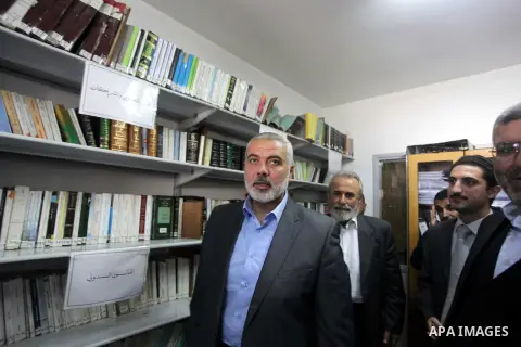 Palestinian Prime Minister in Gaza strip Ismail Haniyeh, visits the Fatwa and Legislation's office, in Gaza City on November 26, 2013. Photo by Ashraf Amra