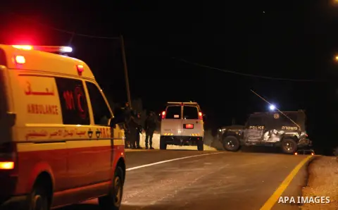 Israeli soldiers stand at the scene of a shooting in which three Palestinians were shot dead by the Israeli army in the village of Yatta, south of the West Bank city of Hebron, on November 26, 2013. Israeli forces shot a...