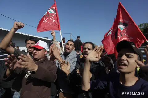 Supporters of Democratic Front for the Liberation of Palestine (DFLP) take part a protest during a demonstration against the Palestinian-Israeli negotiations, in the Gaza on Nov. 28, 2013. Photo by Ashraf Amra