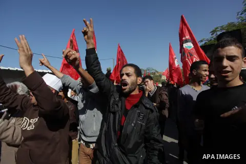 Supporters of Democratic Front for the Liberation of Palestine (DFLP) take part a protest during a demonstration against the Palestinian-Israeli negotiations, in the Gaza on Nov. 28, 2013. Photo by Ashraf Amra