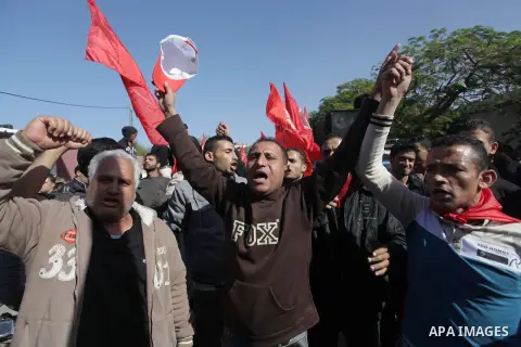 Supporters of Democratic Front for the Liberation of Palestine (DFLP) take part a protest during a demonstration against the Palestinian-Israeli negotiations, in the Gaza on Nov. 28, 2013. Photo by Ashraf Amra