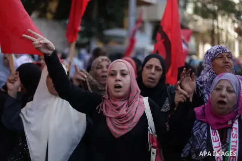 Supporters of Democratic Front for the Liberation of Palestine (DFLP) take part a protest during a demonstration against the Palestinian-Israeli negotiations, in the Gaza on Nov. 28, 2013. Photo by Ashraf Amra