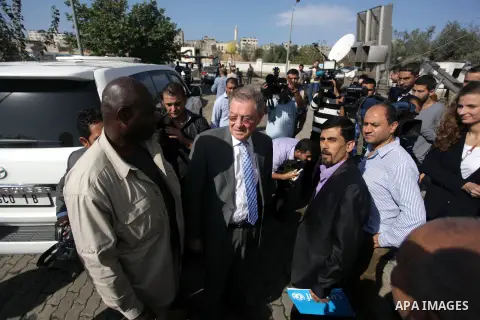 The United Nations Special envoy for the Middle East Robert H. Serry, inspects sanitation after a sewerage pipe in the Zeitoun neighborhood flooded, after the pumps stopped due to lack of fuel and electricity, in Gaza Ci...