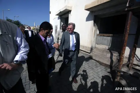 The United Nations Special envoy for the Middle East Robert H. Serry, inspects sanitation after a sewerage pipe in the Zeitoun neighborhood flooded, after the pumps stopped due to lack of fuel and electricity, in Gaza Ci...