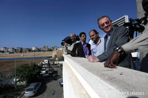 The United Nations Special envoy for the Middle East Robert H. Serry, inspects sanitation after a sewerage pipe in the Zeitoun neighborhood flooded, after the pumps stopped due to lack of fuel and electricity, in Gaza Ci...