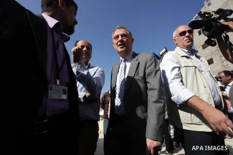 The United Nations Special envoy for the Middle East Robert H. Serry, inspects sanitation after a sewerage pipe in the Zeitoun neighborhood flooded, after the pumps stopped due to lack of fuel and electricity, in Gaza Ci...