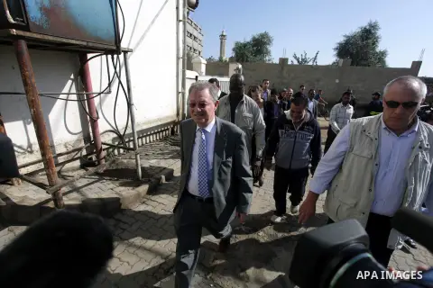 The United Nations Special envoy for the Middle East Robert H. Serry, inspects sanitation after a sewerage pipe in the Zeitoun neighborhood flooded, after the pumps stopped due to lack of fuel and electricity, in Gaza Ci...