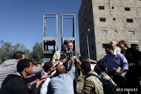The United Nations Special envoy for the Middle East Robert H. Serry, inspects sanitation after a sewerage pipe in the Zeitoun neighborhood flooded, after the pumps stopped due to lack of fuel and electricity, in Gaza Ci...