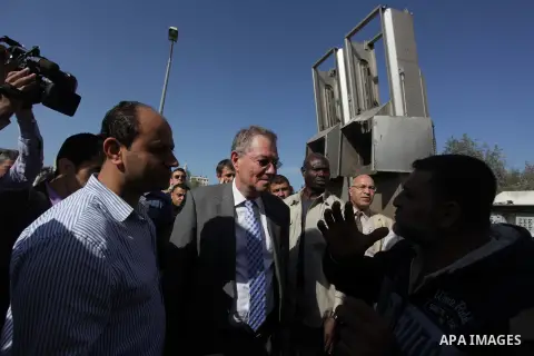 The United Nations Special envoy for the Middle East Robert H. Serry, inspects sanitation after a sewerage pipe in the Zeitoun neighborhood flooded, after the pumps stopped due to lack of fuel and electricity, in Gaza Ci...