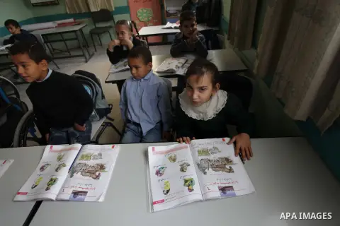 Palestinian disabled children take part in a class at a school of rehabilitation in Gaza City on November 27, 2013. The school founded since 1993 aims to provide educational services, therapeutic, psychological and leisu...