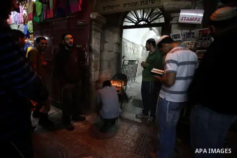 Ultra-Orthodox Jews light the fifth Hanukkah candle during the Jewish holiday of Hanukkah in Jerusalem's Mea Shearim neighbourhood, on Dec. 3, 2013. Hanukkah, also known as the Festival of Lights, is one of the most impo...