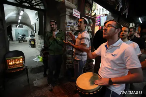 Ultra-Orthodox Jews light the fifth Hanukkah candle during the Jewish holiday of Hanukkah in Jerusalem's Mea Shearim neighbourhood, on Dec. 3, 2013. Hanukkah, also known as the Festival of Lights, is one of the most impo...