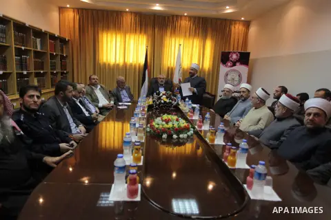 Palestinian Prime Minister in Gaza, Ismail Haniyeh, speaks at a meeting during his visit to the Court of eliminating the legitimate, in Gaza City on Dec. 04, 2013. Photo by Ashraf Amra