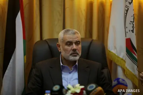 Palestinian Prime Minister in Gaza, Ismail Haniyeh, speaks at a meeting during his visit to the Court of eliminating the legitimate, in Gaza City on Dec. 04, 2013. Photo by Ashraf Amra
