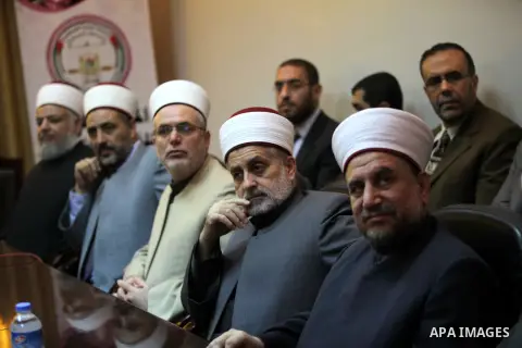 Palestinian Prime Minister in Gaza, Ismail Haniyeh (not seen), speaks at a meeting during his visit to the Court of eliminating the legitimate, in Gaza City on Dec. 04, 2013. Photo by Ashraf Amra