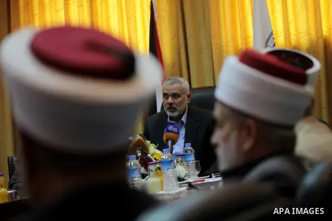 Palestinian Prime Minister in Gaza, Ismail Haniyeh, speaks at a meeting during his visit to the Court of eliminating the legitimate, in Gaza City on Dec. 04, 2013. Photo by Ashraf Amra