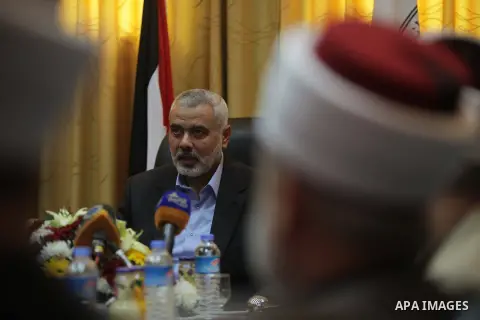 Palestinian Prime Minister in Gaza, Ismail Haniyeh, speaks at a meeting during his visit to the Court of eliminating the legitimate, in Gaza City on Dec. 04, 2013. Photo by Ashraf Amra