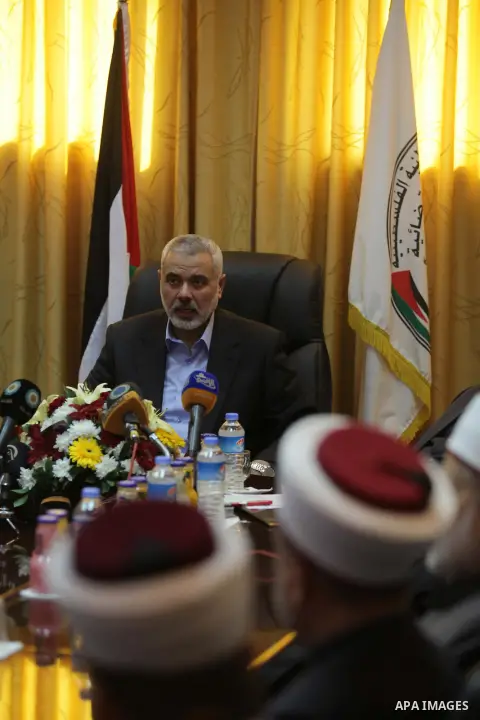 Palestinian Prime Minister in Gaza, Ismail Haniyeh, speaks at a meeting during his visit to the Court of eliminating the legitimate, in Gaza City on Dec. 04, 2013. Photo by Ashraf Amra