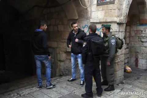 Israeli policemen prevent Palestinian youth from entering the Al-Aqsa Mosque during the holiday of Hanukkah, in Jerusalem's Old City December 4, 2013. Hanukkah, also known as the Festival of Lights, is one of the most im...