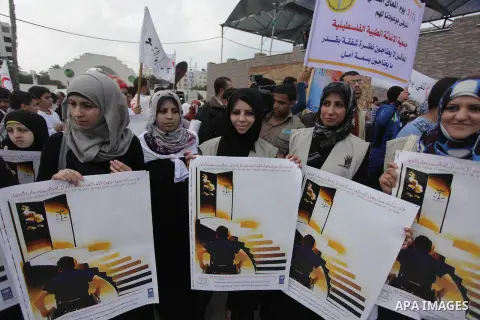 Palestinians and physically challenged people take part in a rally marking the International Day of Persons with Disabilities in Gaza City on Dec. 04, 2013. According to a United Nations report on disabilities, physical,...
