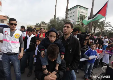 Palestinians and physically challenged people take part in a rally marking the International Day of Persons with Disabilities in Gaza City on Dec. 04, 2013. According to a United Nations report on disabilities, physical,...