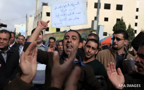 Palestinian teachers shout slogans during a demonstration outside the court, in the West Bank City of Ramallah, Dec. 04, 2013. The Union organized regular strikes in the first half of 2013 to protest unpaid salaries. It...