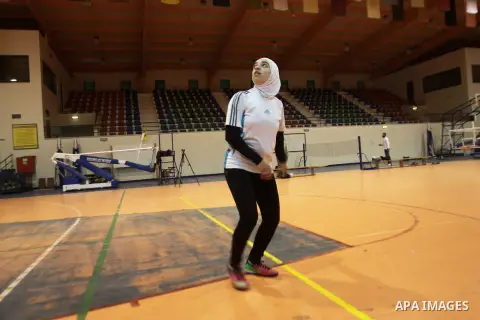 Abir Harb, a 18 year-old Palestinian referee, demonstrates her skills at the stadium of An-Najah national University, in the West Bank City of Nablus, Dec. 04, 2013. Harb is a student in the faculty of sport education an...