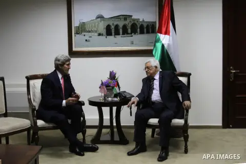 Palestinian President Mahmoud Abbas (R), meets with U.S. Secretary of State John Kerry in the West Bank city of Ramallah on Thursday, Dec. 5, 2013. Kerry said, when he met with Israeli Prime Minister Benjamin Netanyahu e...