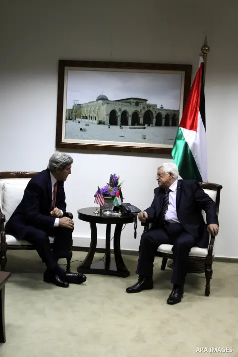 Palestinian President Mahmoud Abbas (R), meets with U.S. Secretary of State John Kerry in the West Bank city of Ramallah on Thursday, Dec. 5, 2013. Kerry said, when he met with Israeli Prime Minister Benjamin Netanyahu e...