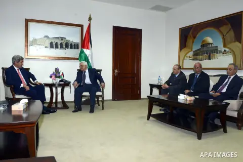 Palestinian President Mahmoud Abbas (R), meets with U.S. Secretary of State John Kerry in the West Bank city of Ramallah on Thursday, Dec. 5, 2013. Kerry said, when he met with Israeli Prime Minister Benjamin Netanyahu e...
