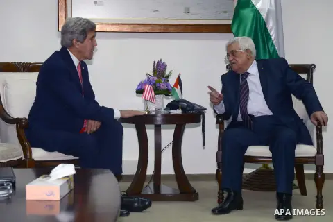 Palestinian President Mahmoud Abbas (R), meets with U.S. Secretary of State John Kerry in the West Bank city of Ramallah on Thursday, Dec. 5, 2013. Kerry said, when he met with Israeli Prime Minister Benjamin Netanyahu e...
