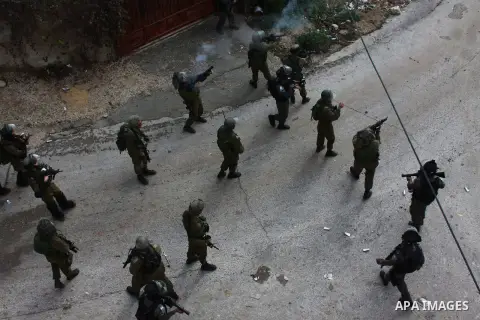 Israeli security forces fire tear gas towards Palestinian protesters as clashes broke out during a demonstration against the expropriation of Palestinian land by Israel in the village of Kfar Qaddum, near the occupied We...
