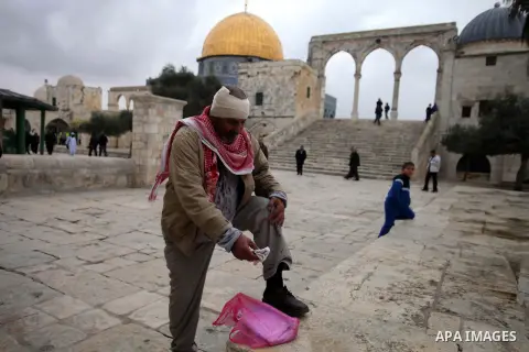 A Palestinian cleans himself after injuring during clashes between Israeli riot police and stone-throwers following Friday prayers at Jerusalem's al-Aqsa mosque compound, on December 6, 2013. Israeli police hurled stun g...