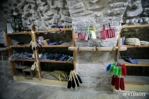 A Palestinian blind man works in making brooms at a workshop in the Old City of Jerusalem on Dec. 07, 2013. The workshop is owned and managed by the Arab Blind Association, which was founded by blind Palestinians in 1932...