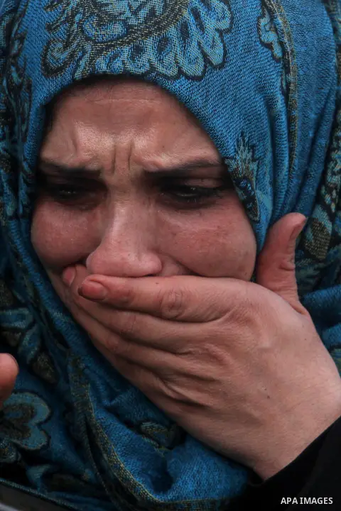 A Palestinian relative of Wajeeh Ramahi, 15, cries during his funeral at the Jalazoun refugee camp near the West Bank city of Ramallah, Sunday, Dec. 8, 2013. Israeli troops shot dead Ramhi during early evening clashes De...