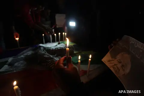 Palestinians hold portraits of late South African leader Nelson Mandela, during a candle vigil in Gaza City on December 8, 2013. Mandela, the revered icon of the anti-apartheid struggle in South Africa and one of the tow...