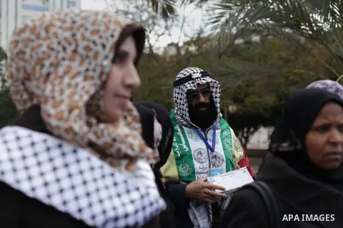 A Palestinian man takes part in a rally calling for ending the Palestinian division, in Gaza city on Dec. 10, 2013. Photo by Ashraf Amra