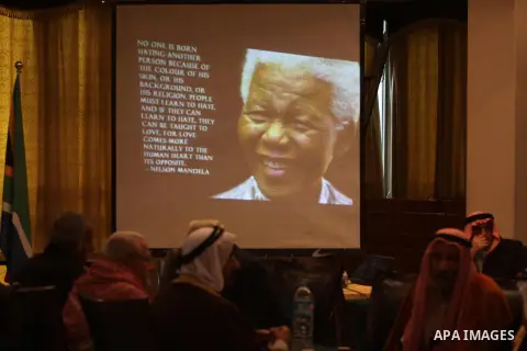 Palestinians attend funeral of late South African leader Nelson Mandela, during a special service in his honour in Gaza city on December 11, 2013. Mandela, South Africa's first black president who steered his nation out...