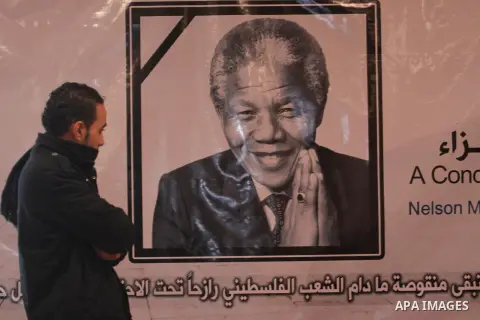 Palestinians attend funeral of late South African leader Nelson Mandela, during a special service in his honour in Gaza city on December 11, 2013. Mandela, South Africa's first black president who steered his nation out...