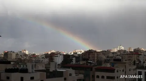 A rainbow shines after heavy rain poured in Gaza City, Thursday, Dec. 12, 2013. The weather in Gaza dropped to 6 degrees Celsius (43 degrees Fahrenheit) with heavy rain showers and cloudy skies. Photo by Yasser Qudih