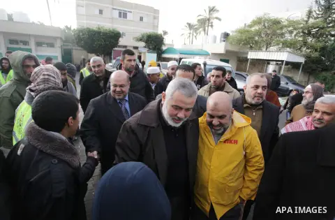 Palestinian Prime Minister in Gaza Strip Ismail Haniyeh, inspects the people who have been evacuated from their houses after flooded with rainwater, in Deir al-Balah in central Gaza Strip December 13, 2013. Haniyeh said...