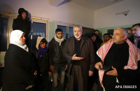 Palestinian Prime Minister in Gaza Strip Ismail Haniyeh, inspects the people who have been evacuated from their houses after flooded with rainwater, in Deir al-Balah in central Gaza Strip December 13, 2013. Haniyeh said...