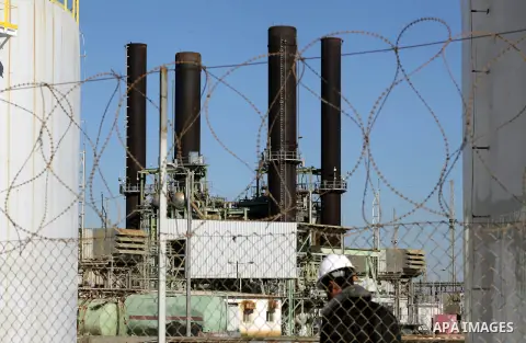 Palestinian fuel tankers park at Gaza's main power plant in Nusseirat, central Gaza Strip,15 December 2013. Palestinian Authority in the West Bank allowed to send the fuel that needed to run the power plant in Gaza Strip...